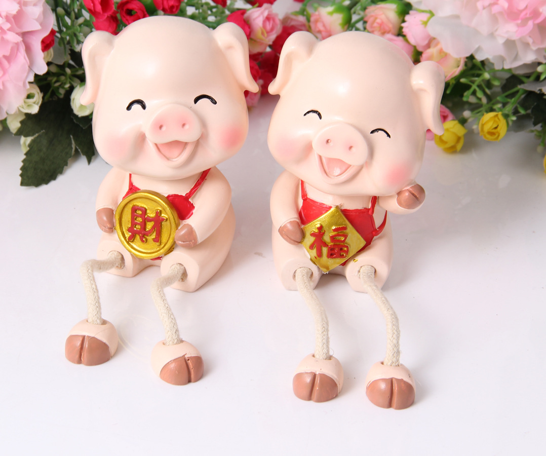 新款家居裝飾新風(fēng)尚 解析吊腳福財豬樹脂擺件與存錢罐的批發(fā)商機(jī)